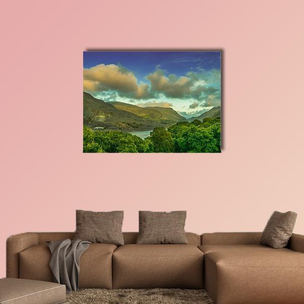 Calm Lake with Mountains and Forest Canvas Wall Art in yellow, green and blue, single panel hung on a wall