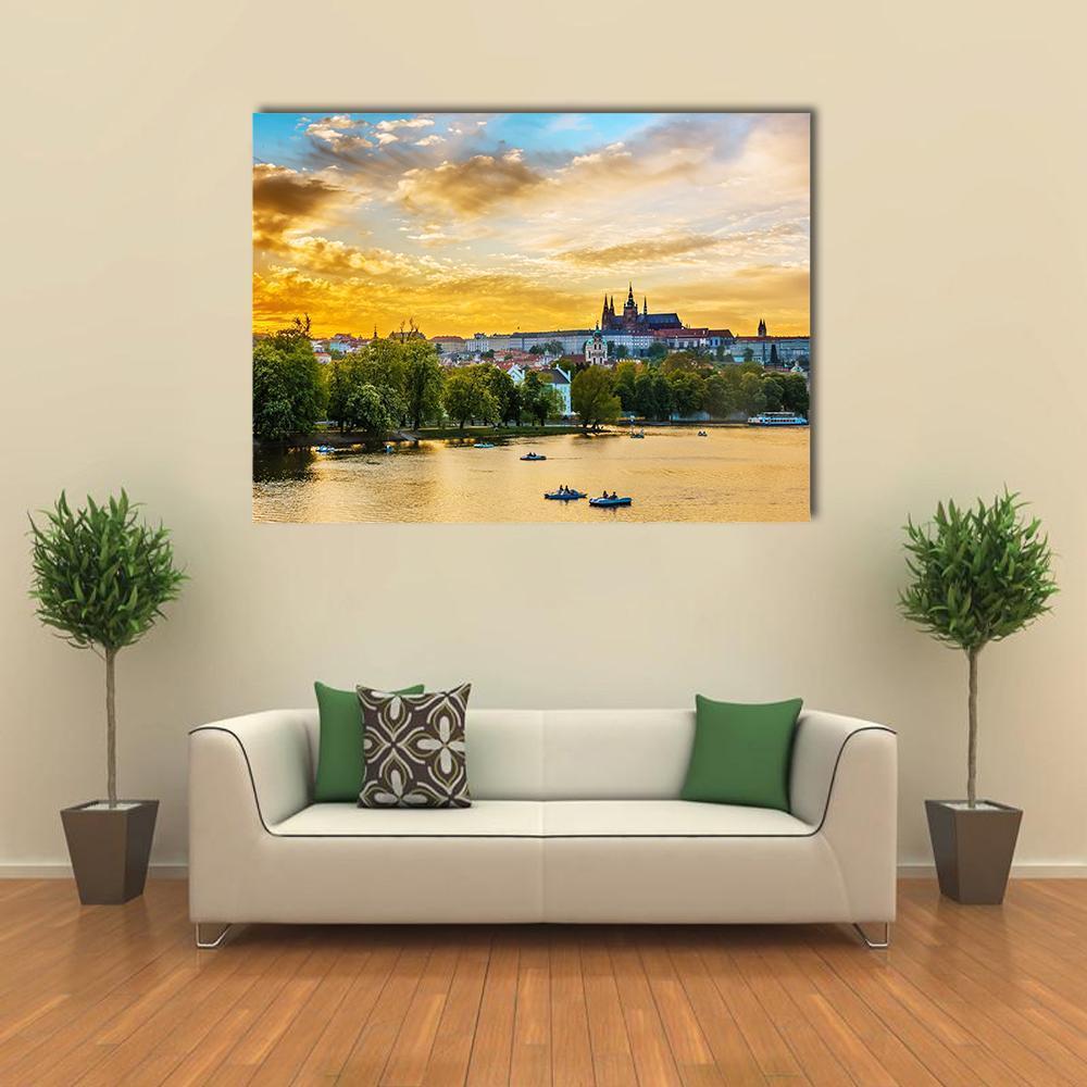 Vltava River at Sunset with Rowboats Canvas Wall Art in orange, yellow and blue, single panel hung on a wall