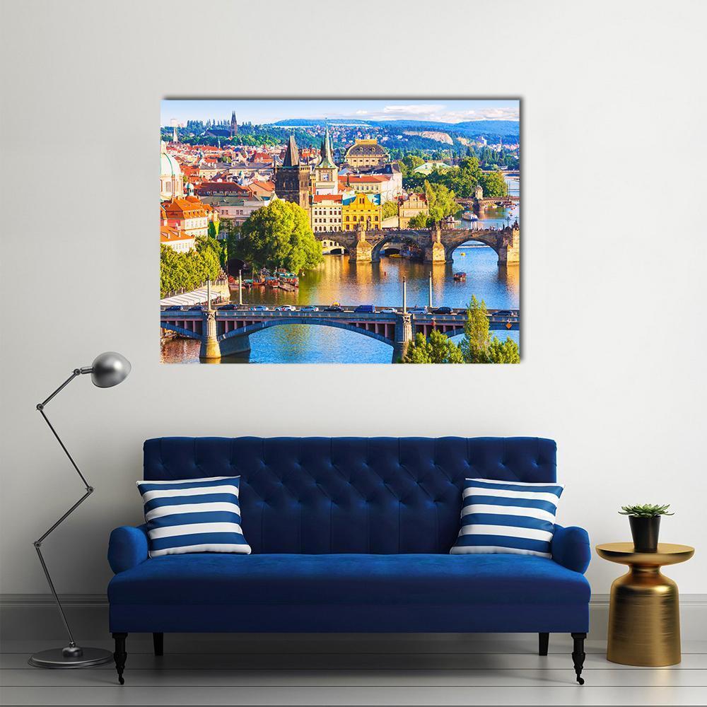 Vltava River and Old Town Skyline Canvas Wall Art in orange, green and blue, single panel hung on a wall