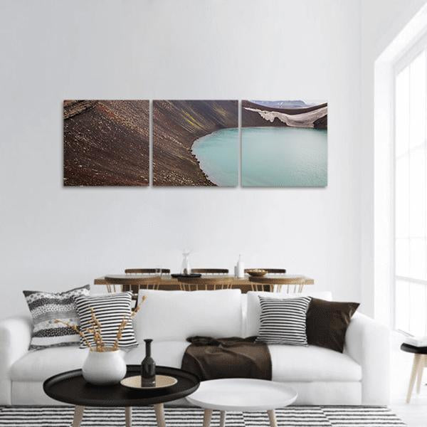 Volcanic Crater Lake in Iceland Panoramic Canvas Wall Art in gray, brown and blue, hung on a wall