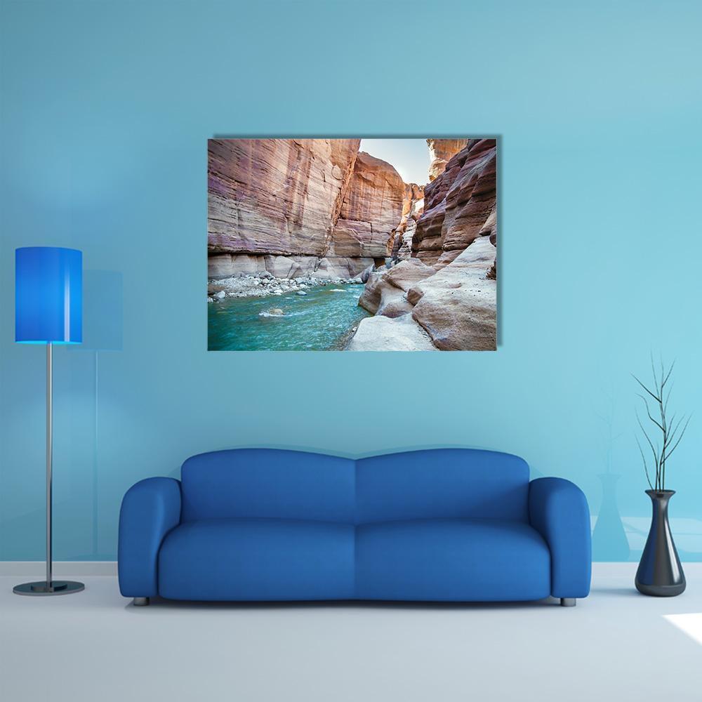Wadi Hasa Creek, Jordan Canvas Wall Art in beige, brown and blue, single panel hung on a wall