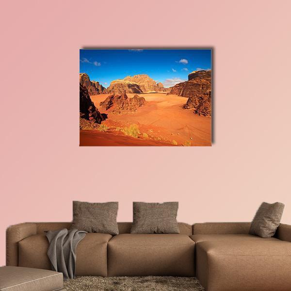 Wadi Rum Desert Landscape Canvas Wall Art in brown, orange and blue, single panel hung on a wall