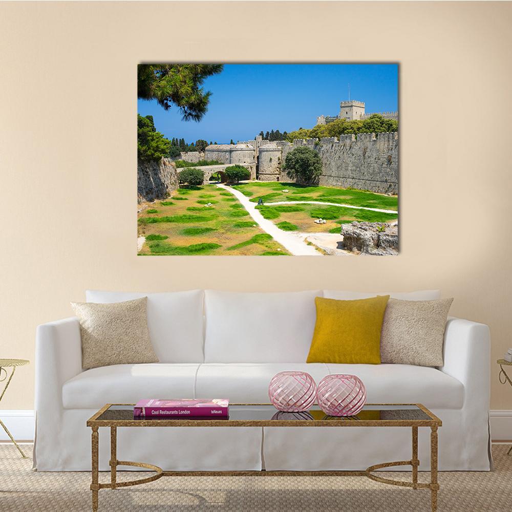 Stone Fortress Walls and Path Canvas Wall Art in gray, green and blue, single panel hung on a wall