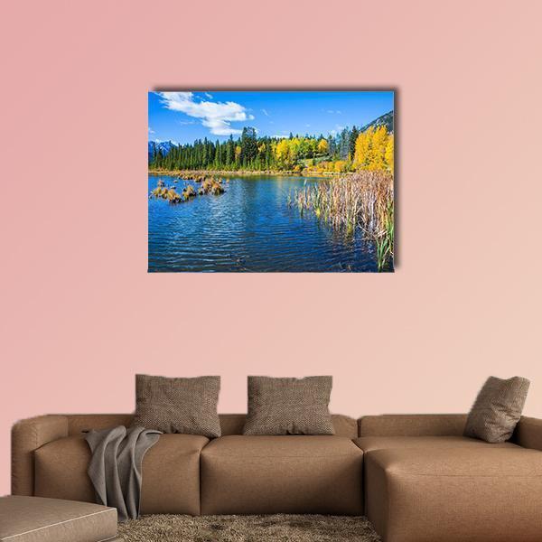 Warm Summer on Lake Vermillon Canvas Wall Art in yellow, green and blue, single panel hung on a wall
