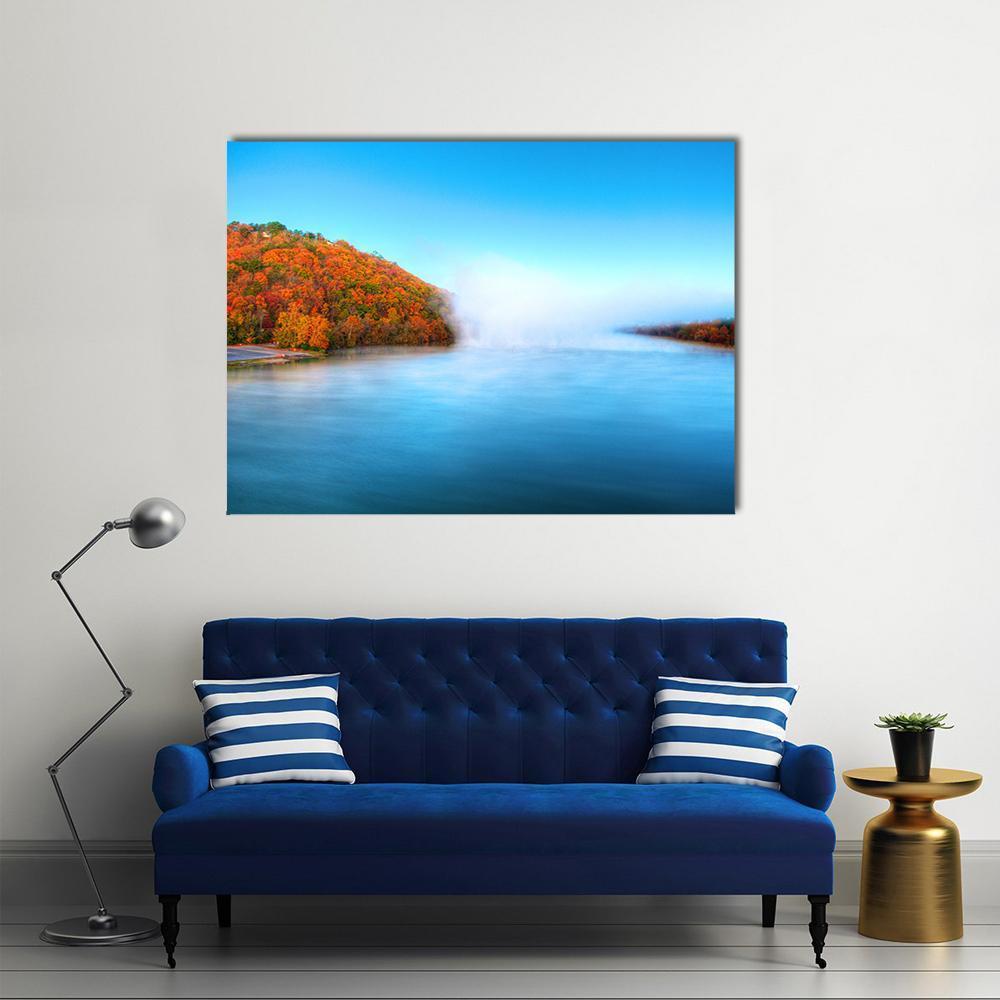 Warm Autumn River with Mist Canvas Wall Art in orange, yellow and blue, single panel hung on a wall