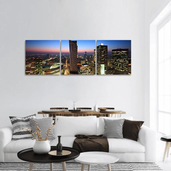 Warsaw City Center at Sunset Panoramic Canvas Wall Art in black, orange and blue, hung on a wall