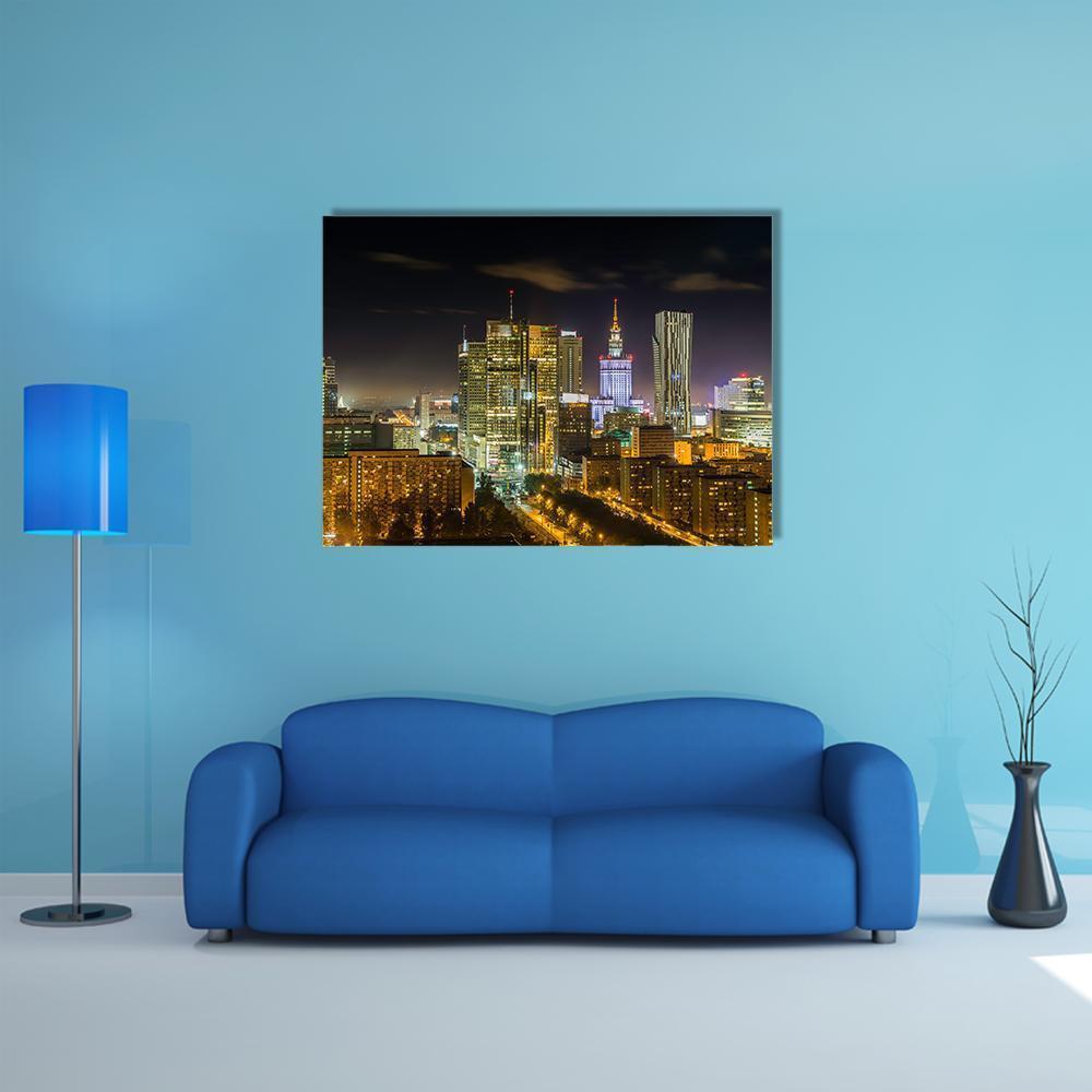 Warsaw Downtown Night Skyline Canvas Wall Art in black, gold and yellow, single panel hung on a wall