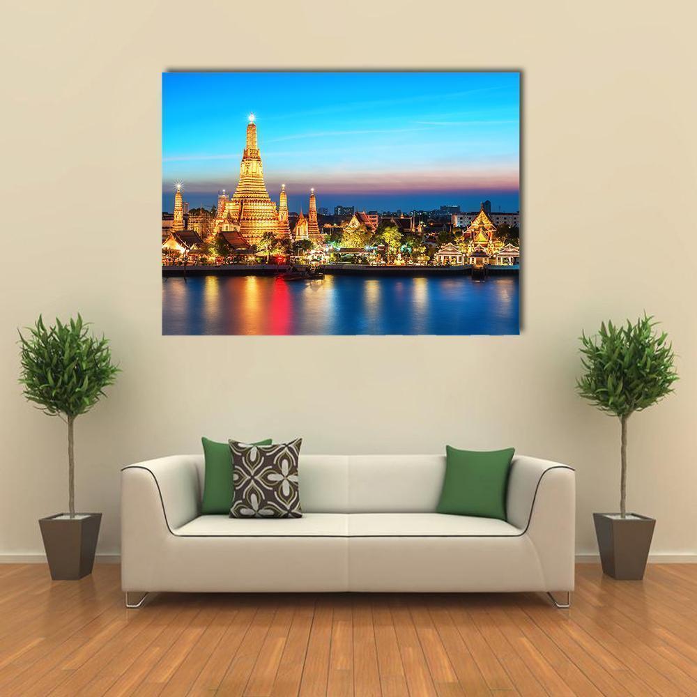 Wat Arun Night View Canvas Wall Art in gold, yellow and blue, single panel hung on a wall