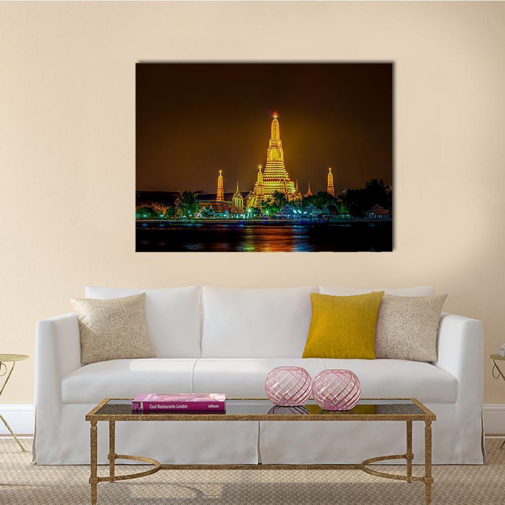 Wat Arun Temple Night Reflection Canvas Wall Art in black, gold and yellow, single panel hung on a wall