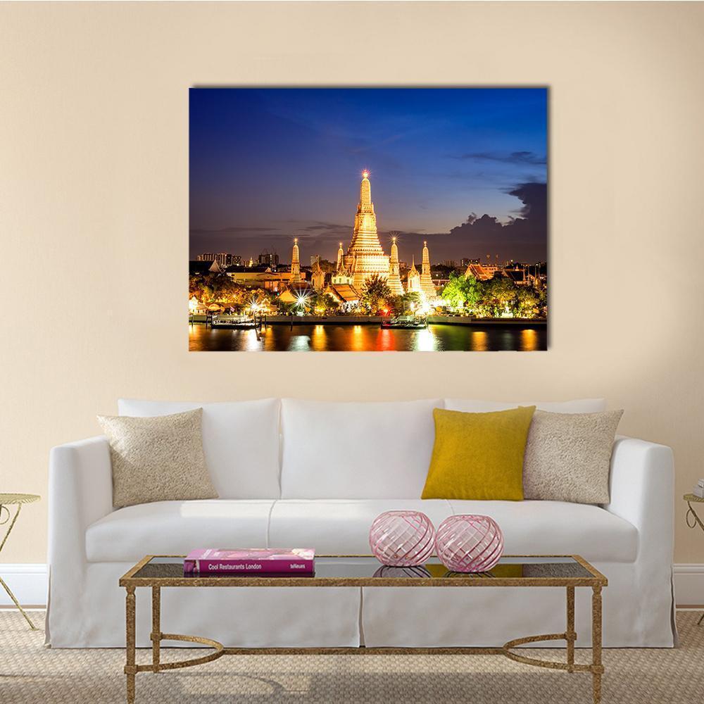 Wat Arun Temple at Dusk Canvas Wall Art in gold, yellow and blue, single panel hung on a wall
