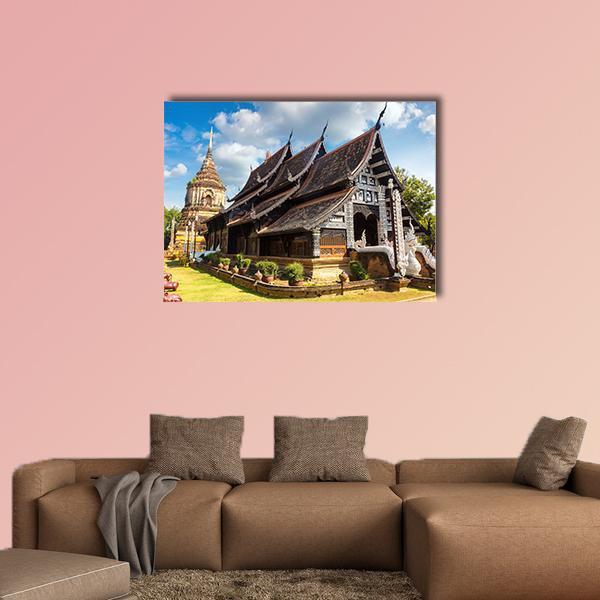 Wat Lok Molee Temple Canvas Wall Art in brown, green and blue, single panel hung on a wall