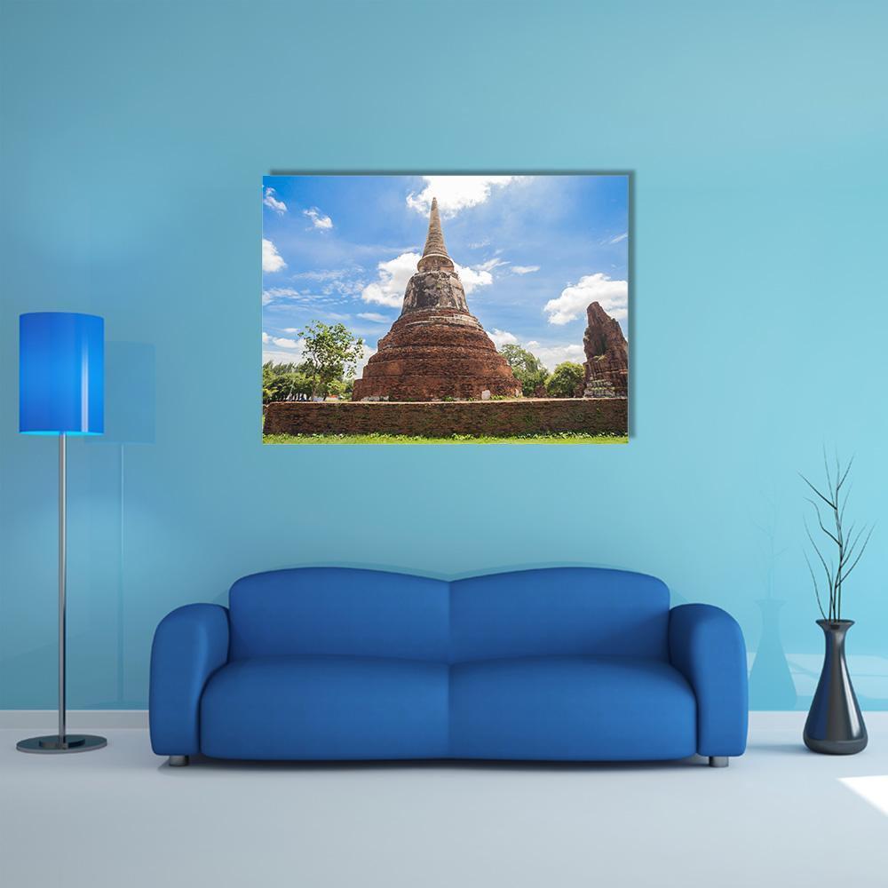Wat Mahathat Stupa, Thailand Canvas Wall Art in brown and blue, single panel hung on a wall