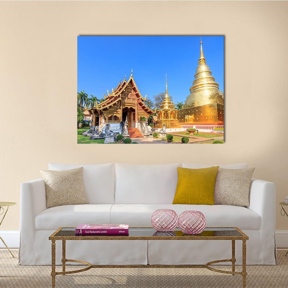 Wat Phra Singh Chiang Mai Temple Canvas Wall Art in brown, gold and blue, single panel hung on a wall