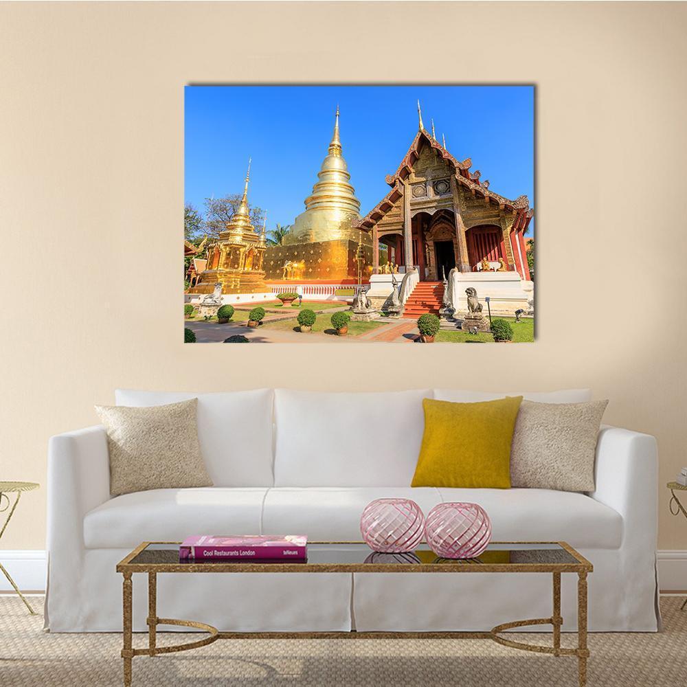 Wat Phra Singh Woramahawihan Canvas Wall Art in brown, gold and blue, single panel hung on a wall