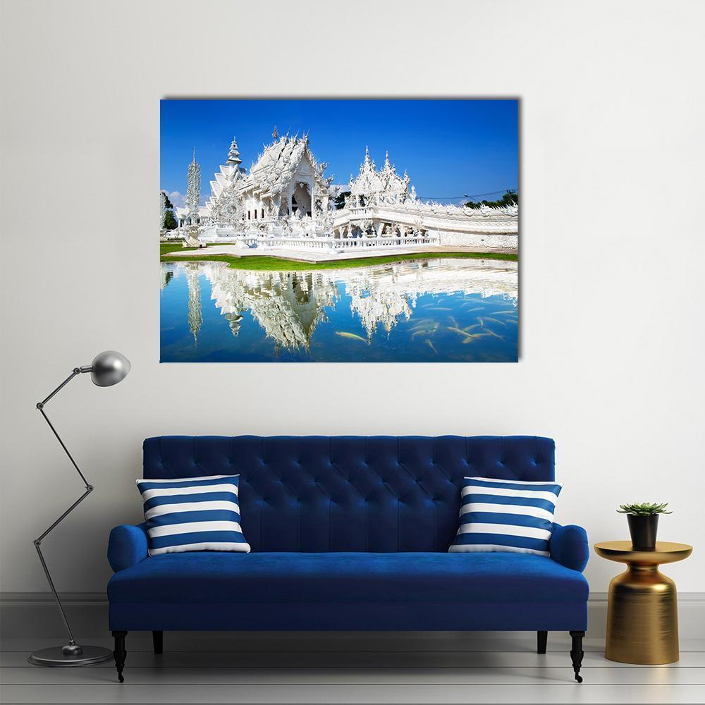 Wat Rong Khun Temple Reflection in Thailand Canvas Wall Art in white and blue, single panel hung on a wall