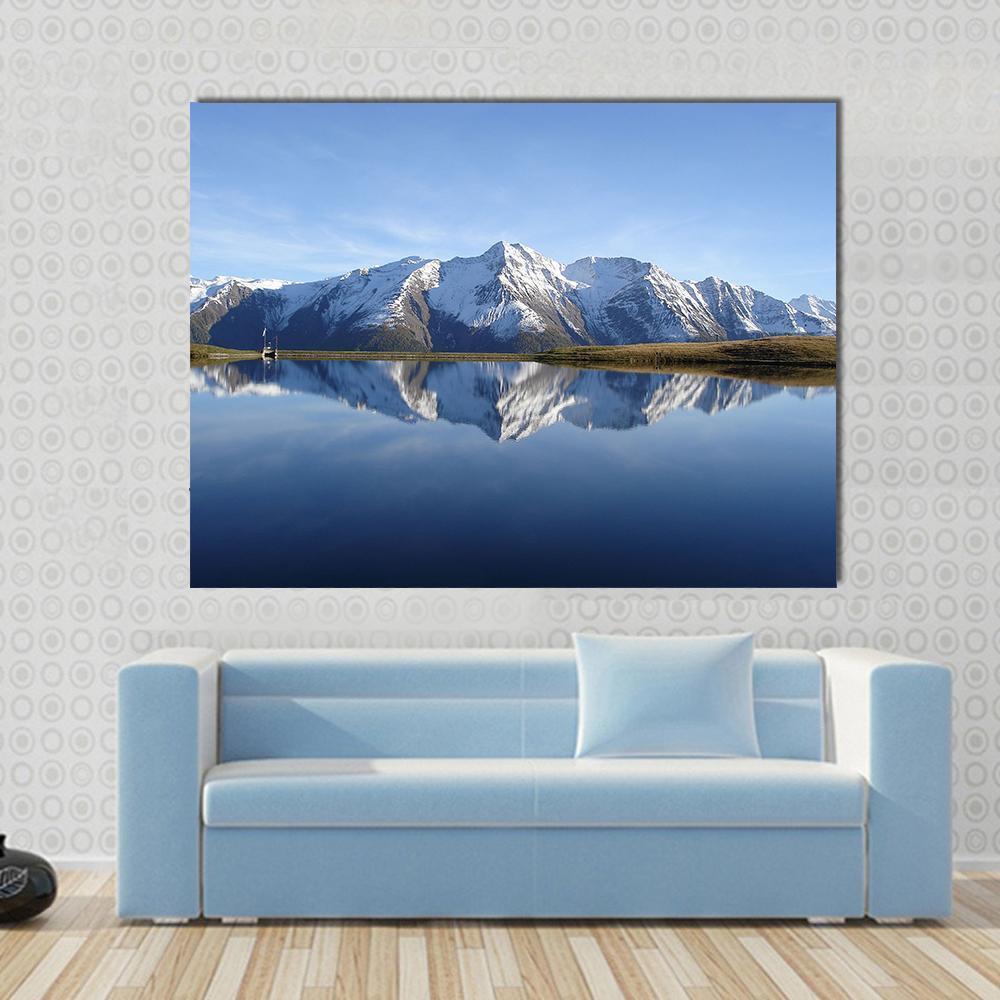 Bettmersee Lake Switzerland Canvas Wall Art in white and blue, single panel hung on a wall