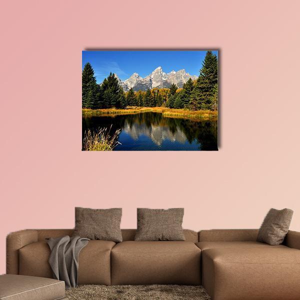 Autumn Reflections in the Grand Tetons Canvas Wall Art in brown, green and blue, single panel hung on a wall