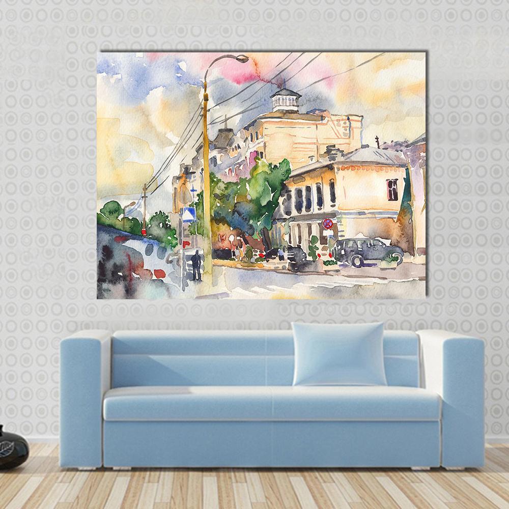 Watercolor City Street Illustration Canvas Wall Art in beige, yellow and blue, single panel hung on a wall