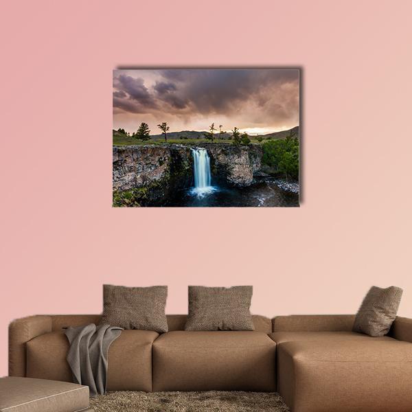 Mongolian Waterfall at Golden Hour Canvas Wall Art in gray, brown and orange, single panel hung on a wall
