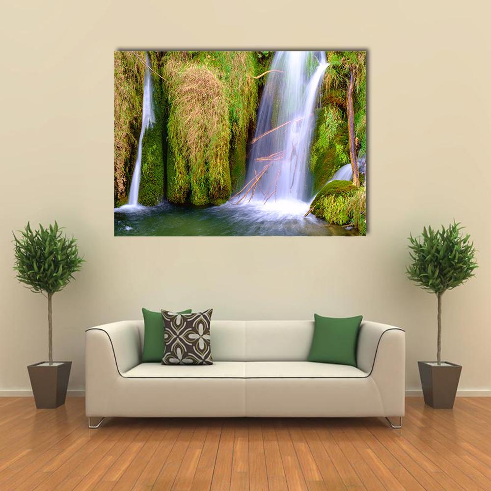 Waterfall in Plitvice National Park Canvas Wall Art in white, brown and green, single panel hung on a wall