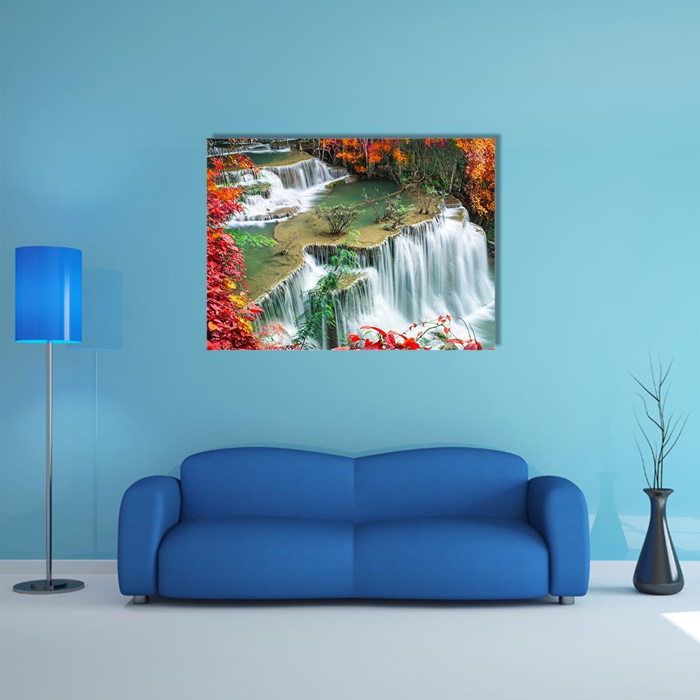 Tiered Autumn Waterfalls with Turquoise Pools Canvas Wall Art in white, orange and green, single panel hung on a wall