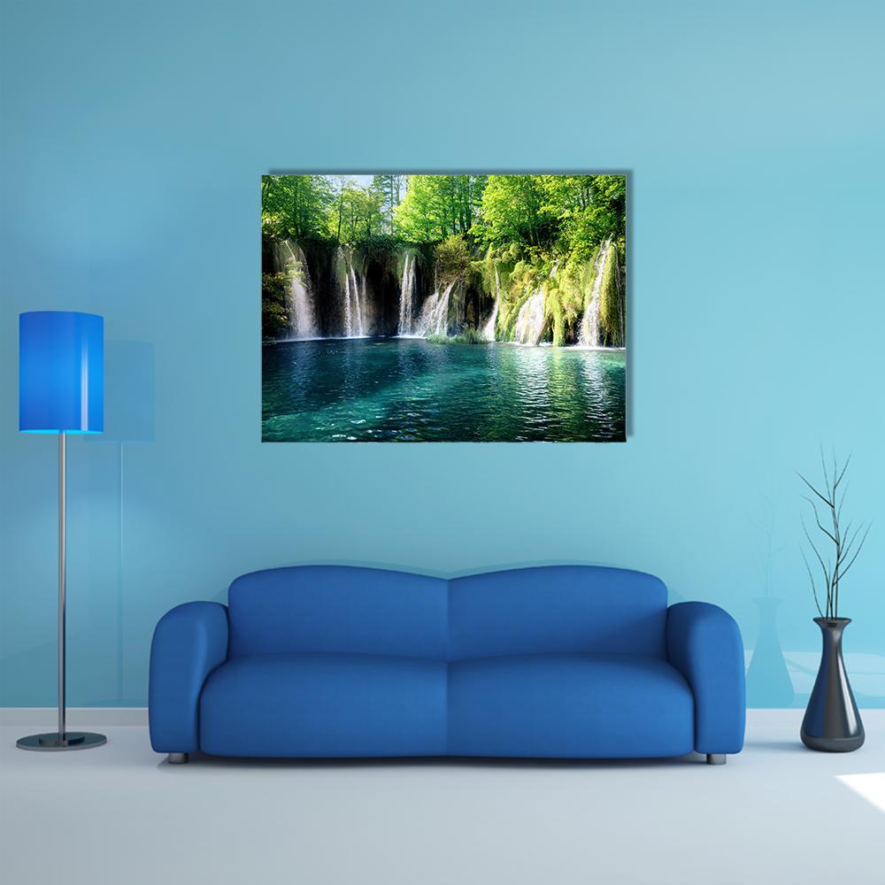 Plitvice Waterfalls in Lush Forest Canvas Wall Art in green and blue, single panel hung on a wall