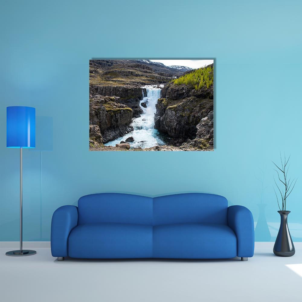 Waterfall in Fossa River Canvas Wall Art in white, gray and brown, single panel hung on a wall