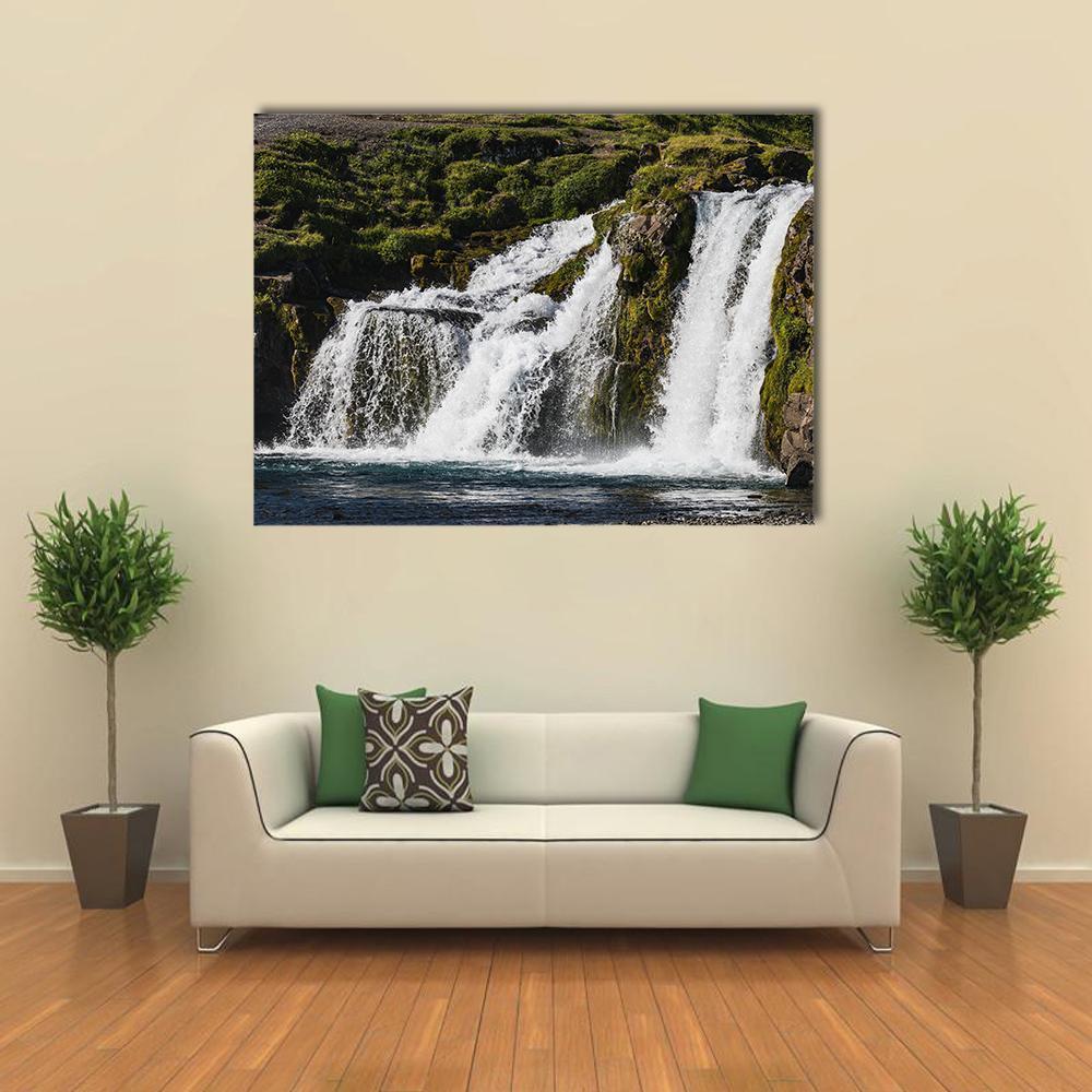 Cascading Waterfall with Mossy Rocks Canvas Wall Art in white, brown and green, single panel hung on a wall
