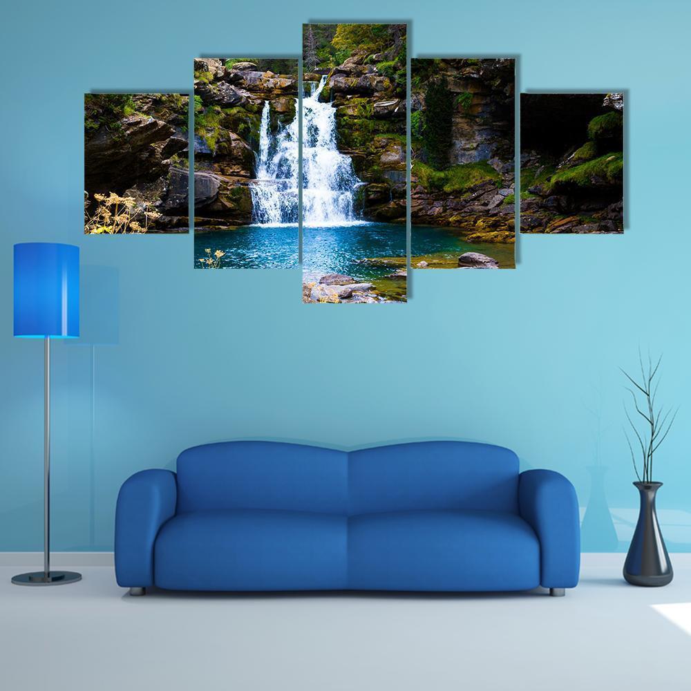 Waterfall in Monter Perdido Spain Canvas Wall Art in brown, green and blue, 5 panel Star layout hung on a wall