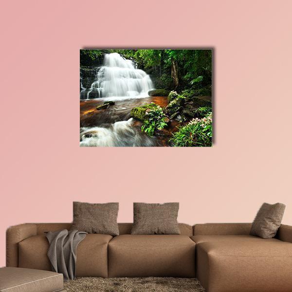 Thai National Park Waterfall Canvas Wall Art in white, brown and green, single panel hung on a wall