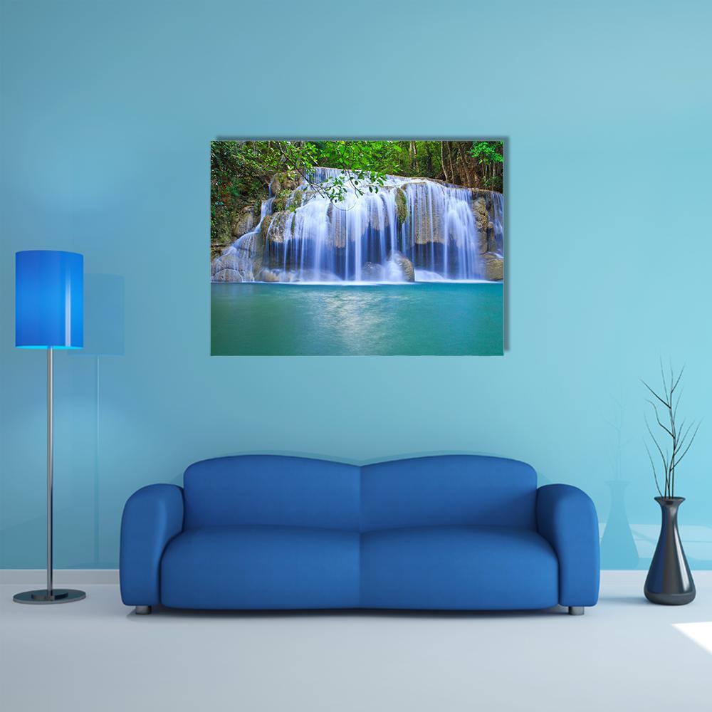 Silky Waterfall Over Turquoise Pond Canvas Wall Art in white, green and blue, single panel hung on a wall