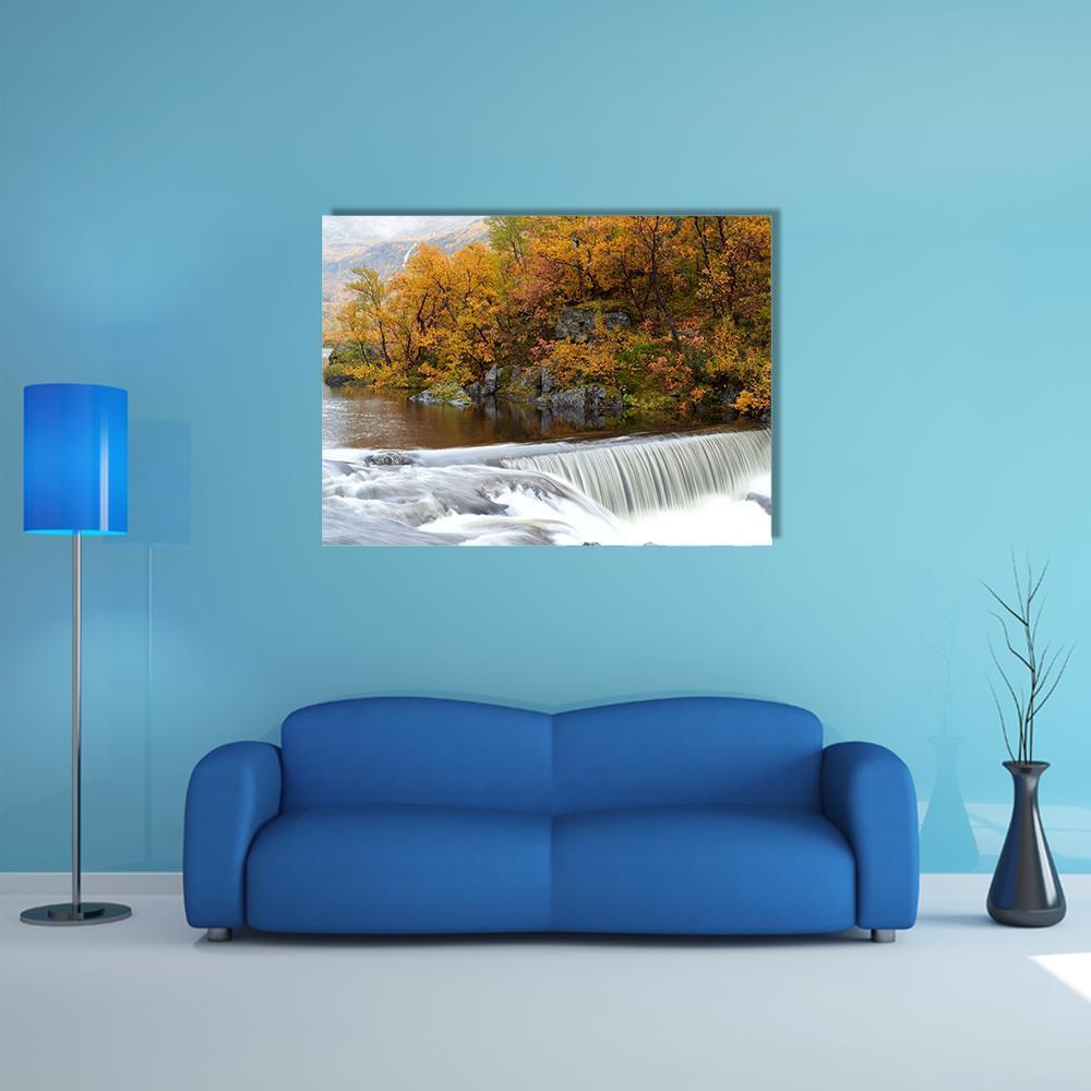 Autumn Waterfall in the Woods Canvas Wall Art in white, brown and orange, single panel hung on a wall