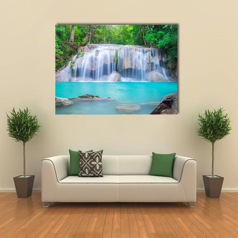 Tropical Forest Waterfall with Turquoise Pool Canvas Wall Art in white, green and blue, single panel hung on a wall