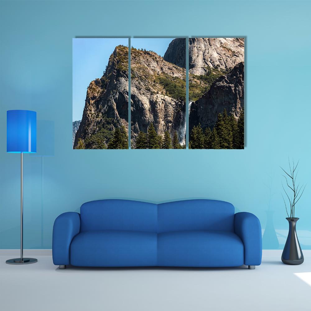 Yosemite Waterfall on a Summer Day Canvas Wall Art in gray, brown and blue, 3 panel horizontal set hung on a wall