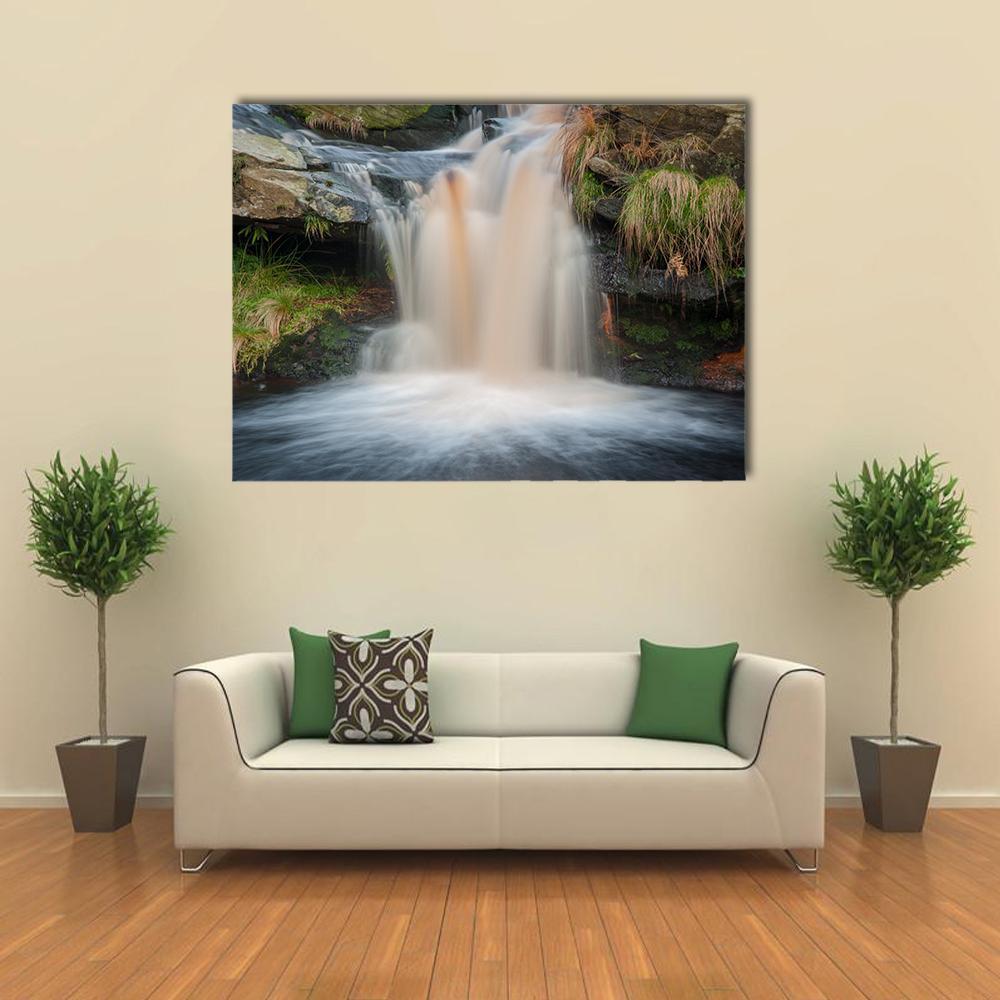 Waterfall on Moorland Canvas Wall Art in white, brown and green, single panel hung on a wall