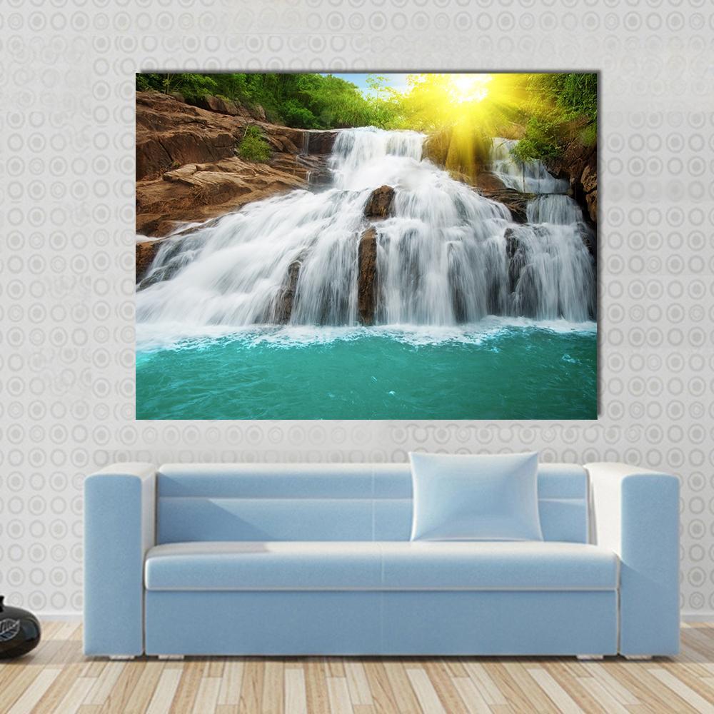 Waterfall Pool in Rain Forest Canvas Wall Art in brown, green and blue, single panel hung on a wall