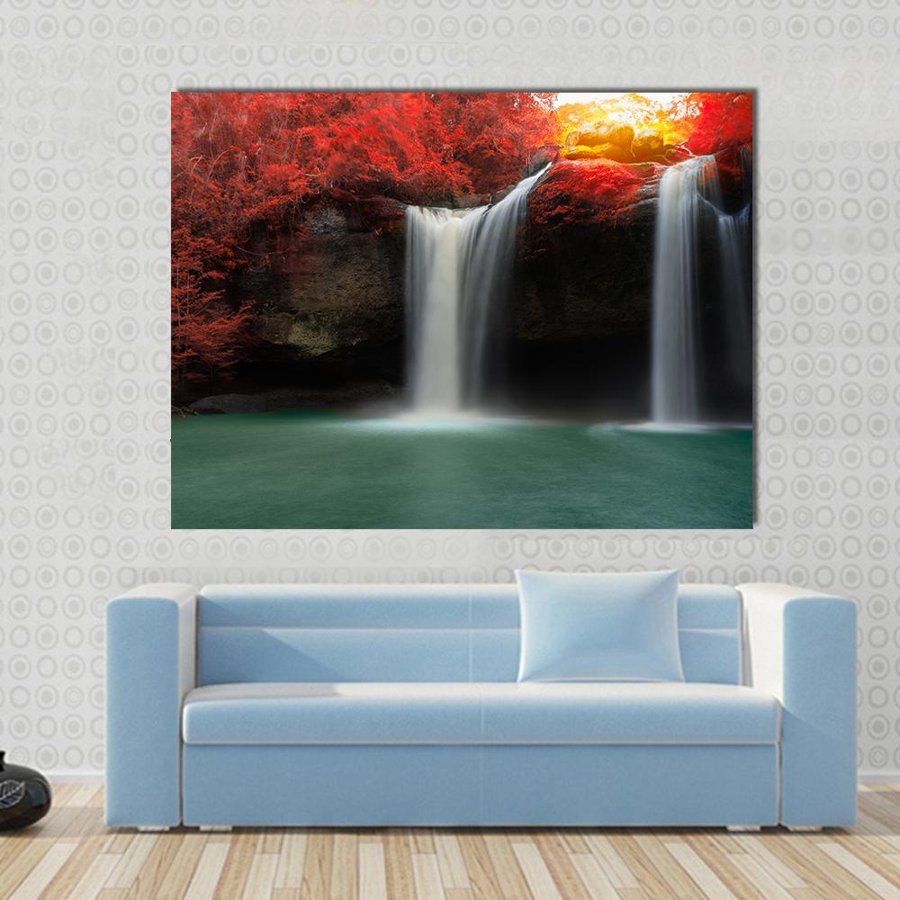 Waterfall with Red Trees Canvas Wall Art in black, red and green, single panel hung on a wall