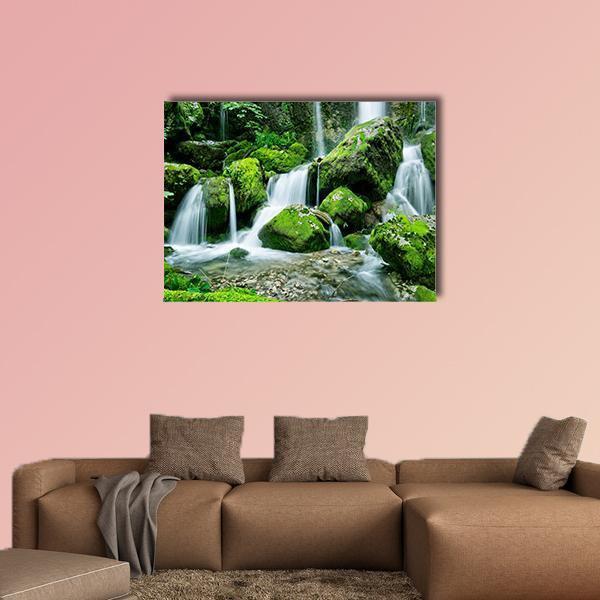 Multi-tier Forest Waterfall Canvas Wall Art in white, gray and green, single panel hung on a wall