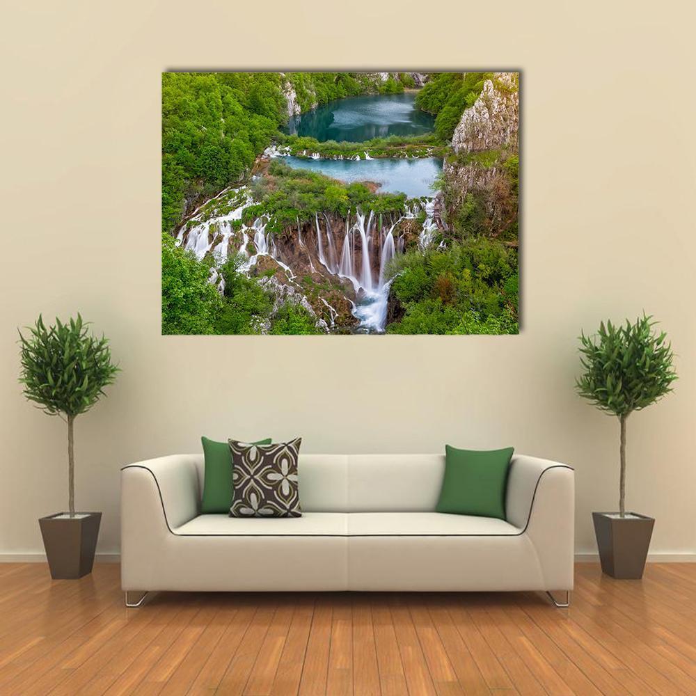 Cascading Waterfalls at Plitvice Canvas Wall Art in white, green and blue, single panel hung on a wall