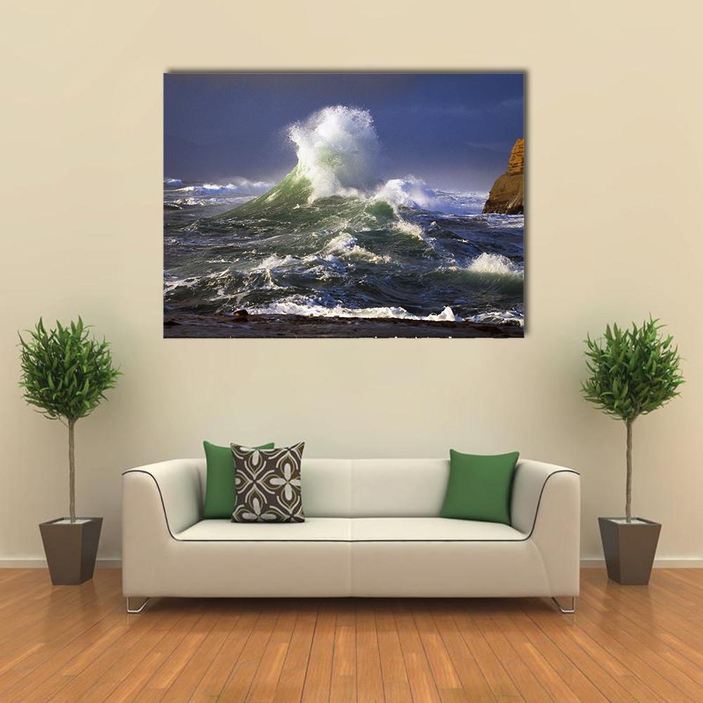 Wave Crashing Distant Storm Cape Kiwanda Canvas Wall Art in white, green and blue, single panel hung on a wall