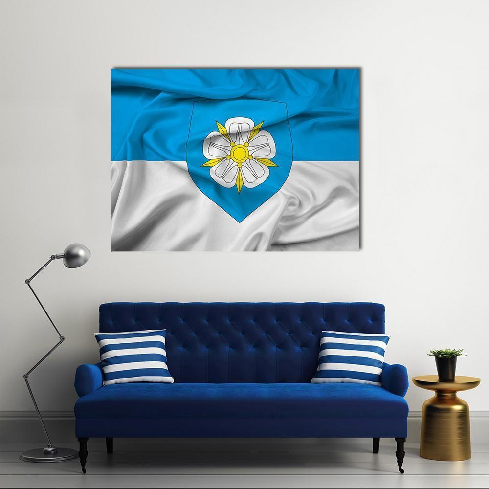 Viljandi Flag with Creased Fabric Texture Canvas Wall Art in white and blue, single panel hung on a wall