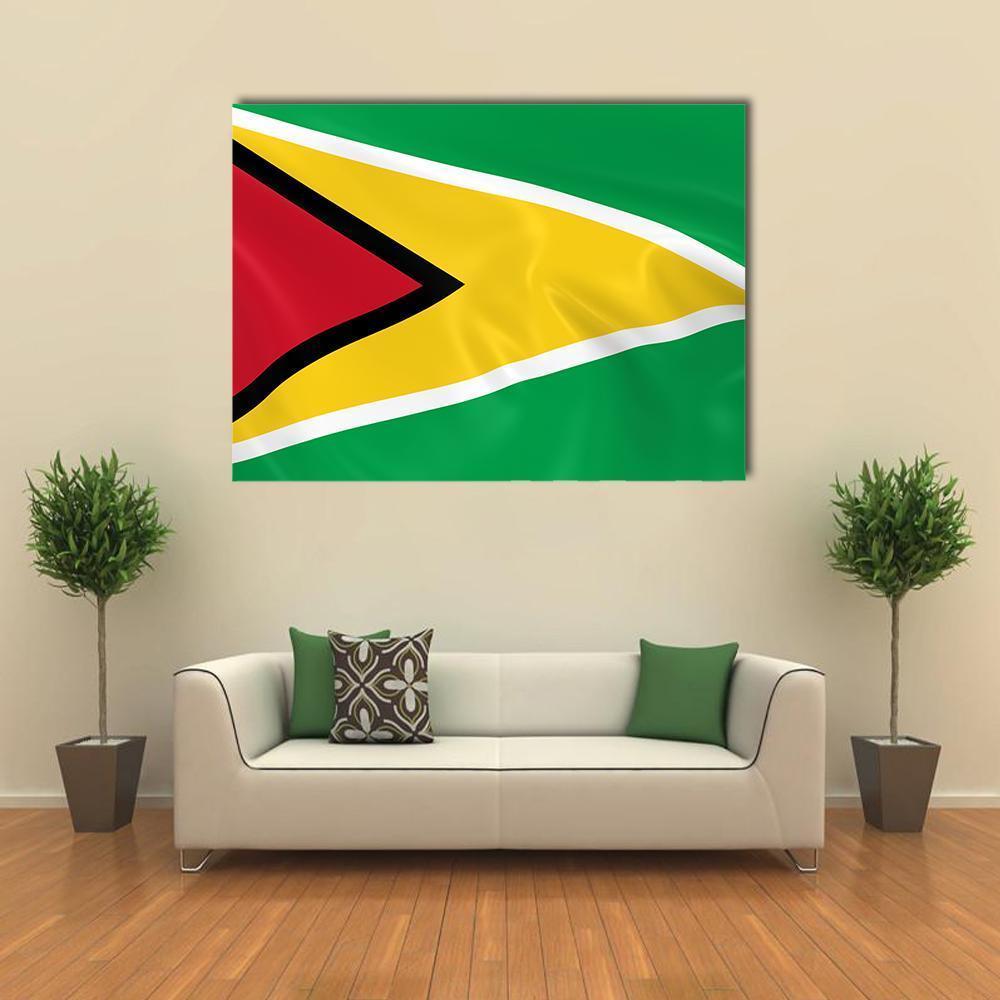 Waving Guyana Flag Canvas Wall Art in red, yellow and green, single panel hung on a wall