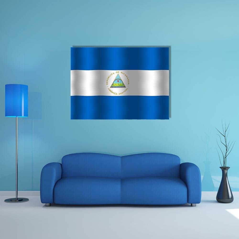 Nicaraguan Flag with Coat of Arms Canvas Wall Art in white and blue, single panel hung on a wall