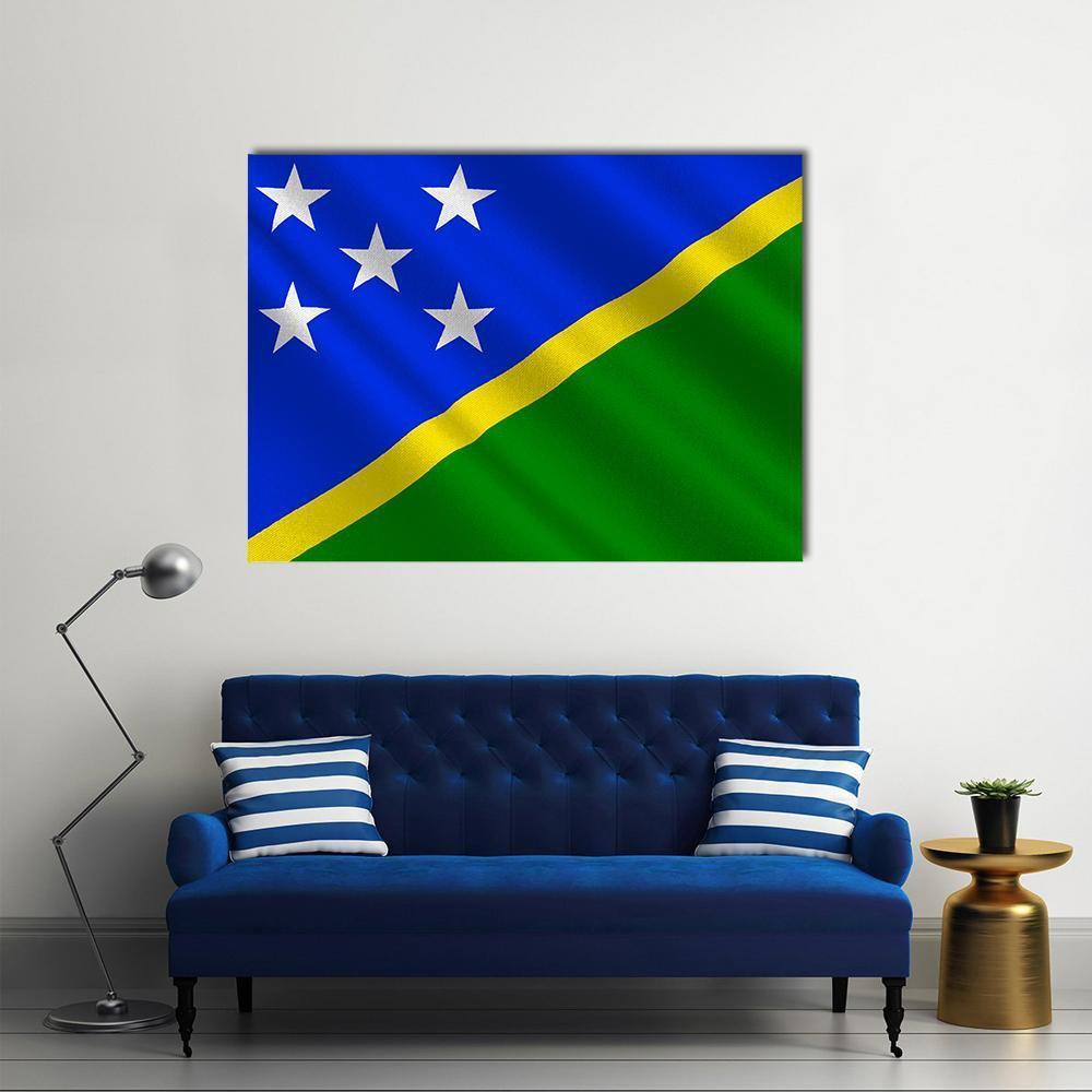 Waving Solomon Islands Flag Canvas Wall Art in yellow, green and blue, single panel hung on a wall