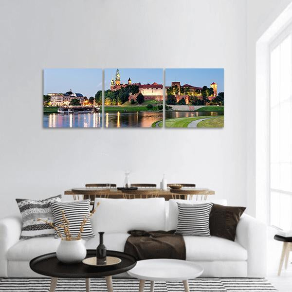 Wawel Castle at Dusk Panoramic Canvas Wall Art in brown, green and blue, hung on a wall