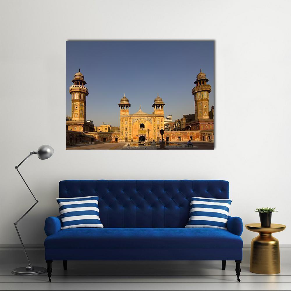 Wazir Khan Mosque at Golden Hour Canvas Wall Art in gold, yellow and blue, single panel hung on a wall
