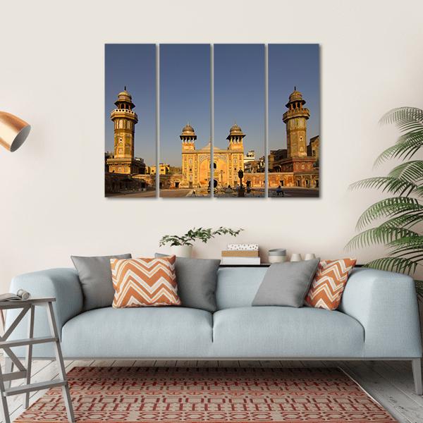 Wazir Khan Mosque at Golden Hour Canvas Wall Art in gold, yellow and blue, hung on a wall