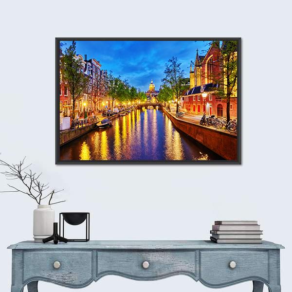 Westerkerk Canal View at Night, Amsterdam Canvas Wall Art in orange, yellow and blue, framed canvas, product view on a white background