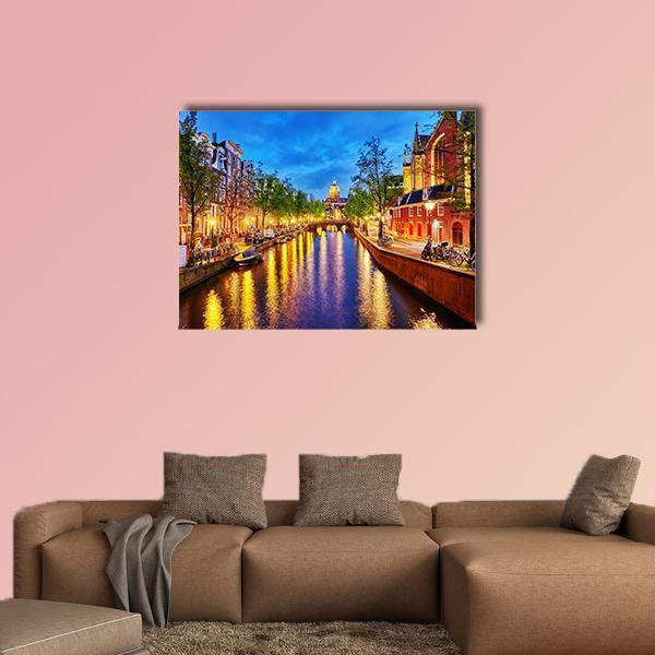 Westerkerk Canal View at Night, Amsterdam Canvas Wall Art in orange, yellow and blue, single panel hung on a wall