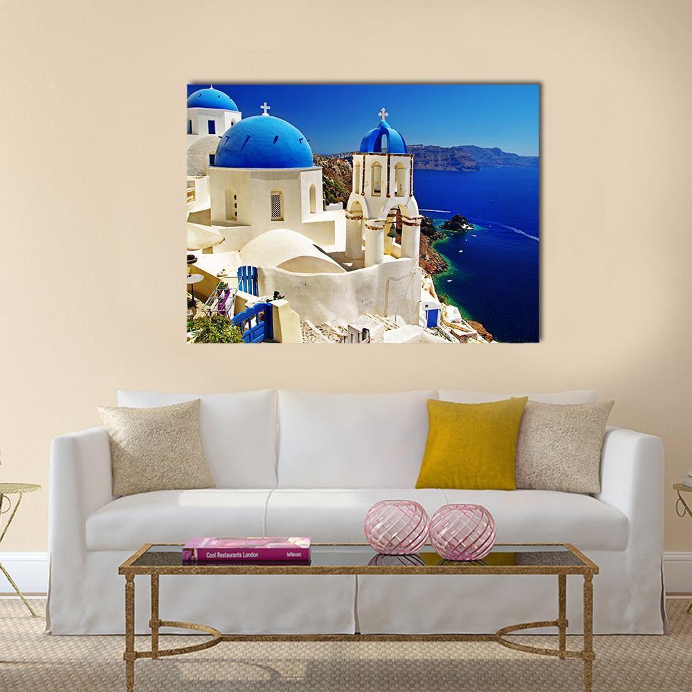 Serene Blue and White Santorini Scene Canvas Wall Art in white and blue, single panel hung on a wall